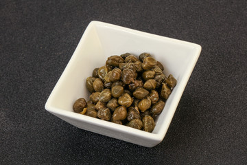 Tasty capers in the bowl