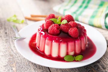 Delicious panna cotta dessert with raspberries sauce