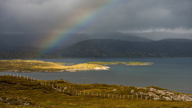 isolated light and rainbow over Scalpay, Outer Hebrides