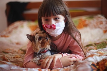 girl with a dog at home playing