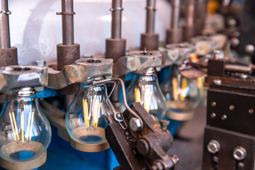 Obraz na płótnie Canvas Automated workshop conveyor for production of glass lamps bulbs factory