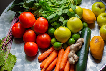 Close up of fresh vegetables and fruits on a table