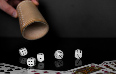 Dices and cards on a table. Usable for home gaming or in a casino