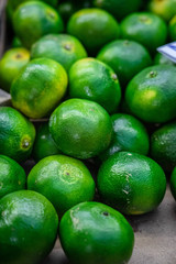 fresh green mandarines in the market