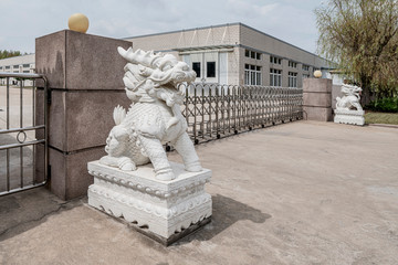 Stone Kylin (Qilin) statue in China. Mythical chinese chimerical creature like lion dragon with hooves