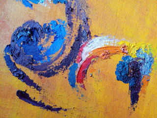 Smears of oil paint on canvas. Blue, red, yellow, white, orange on yellow in different shades. Close-up.