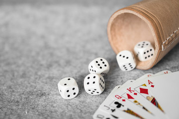 Dices and cards on a table. Usable for home gaming or in a casino