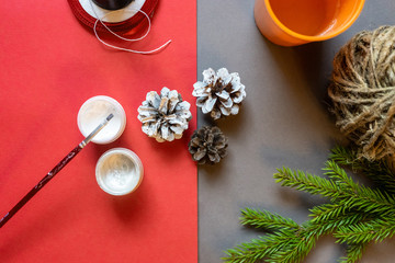 05/14/2020 Russia. St. Petersburg. Making Christmas decorations. Original month with cones and fir branch. DIY concept. Step-by-step photo instructions. Step 2. Paint the bumps.