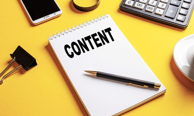 The word content is written in a white Notepad on a yellow background.