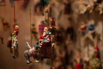 Christmas tree decoration/figures in a sale booth on a historic xmas market in Bremen, Germany with blurry Background and no people