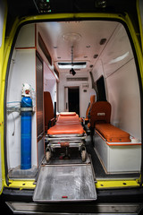 Medical ambulance car with a stretcher and equipment inside, view from the back © Anna Kosolapova