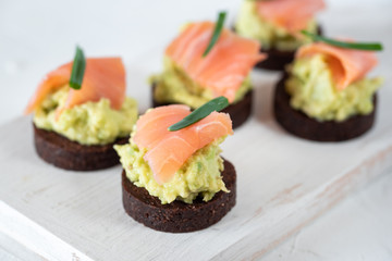 Avocado paste with salmon on wholemeal bread