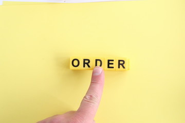 Hand clicking on an order button.