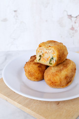 Croquettes potato filled with chili on a white plate. Asian cake cuisine dish for meal