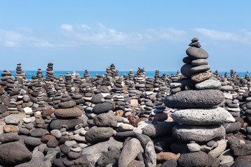Stone cairns on Puerto de la Cruz coast, Tenerife island, Spain