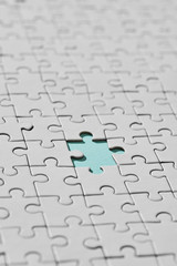 Background of white puzzle with missing piece