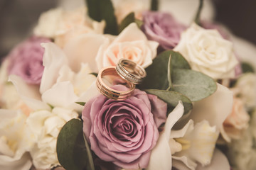 Wedding rings on the bride's bouquet