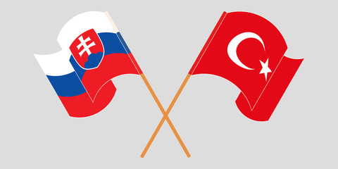 Crossed and waving flags of Slovakia and Turkey
