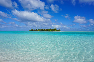 tropical island in turquoise ocean in cook islands