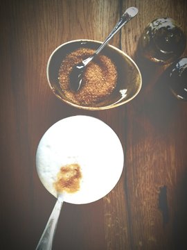 Overhead View Of Bowls With Brown Sugar And Cream