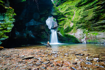 Small waterfall in St. Nectan’s glen in Cornwall, UK
