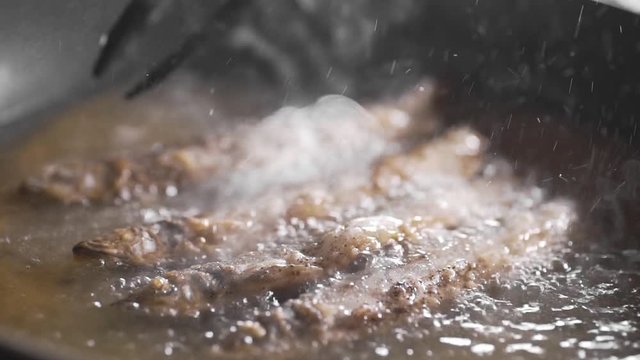 capelin is fried in the hot boling olive oil