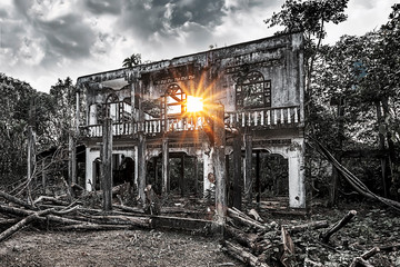 Old abandoned building with the sun shining through it