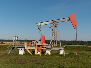 Fototapeta na wymiar Oil pumpjack. Oil industry equipment.