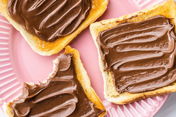 Toast bread with hazelnut spread. Sweet chocolate cream.