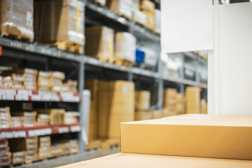 Naklejka na ściany i meble Stack of cardboard boxes in smart warehouse industry logistic.