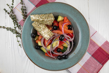 Italian cuisine. Greek salad on a white background