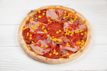 Italian pizza on white wooden background