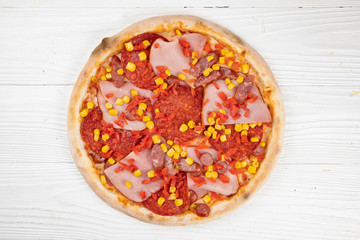 Italian pizza on white wooden background