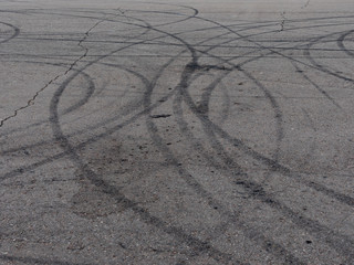 Fototapeta na wymiar Black trail from rubber tires on the asphalt