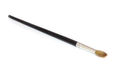Art brush with a black pen on a white background