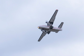 Airplane flies against a background of blue sky