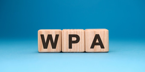 WPA - text concept on wooden cubes with gradient blue background