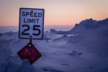 Speeding sign in the Arctic Snow