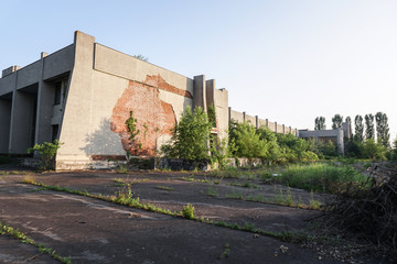 Ruins of abandoned buildings in 1986. Soviet architecture in Chernobyl. Danger of infection of...