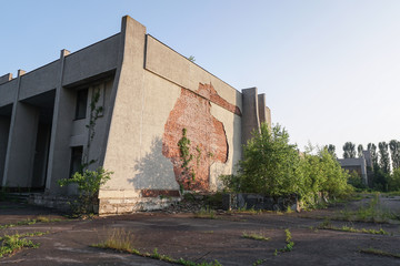 Ruins of abandoned buildings in 1986. Soviet architecture in Chernobyl. Danger of infection of...