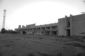 Ruins of abandoned buildings in 1986. Soviet architecture in Chernobyl. Danger of infection of...