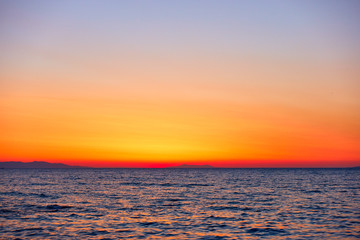 Colorful orange sky and the sea at sunset