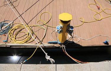Service column on the pier. Specialized equipment for organizing the supply of technical and drinking water, electricity and other communications to ships. Service speakers are installed on berths and