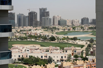 Fototapeta premium The view from the window of a high-rise building on new buildings in Dubai