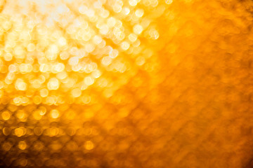 Yellow orange defocused background. Abstract texture for holidays and christmas.