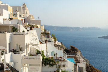 Obraz premium Terraces and church lightened by last sun in Fira, Santorini, Greece