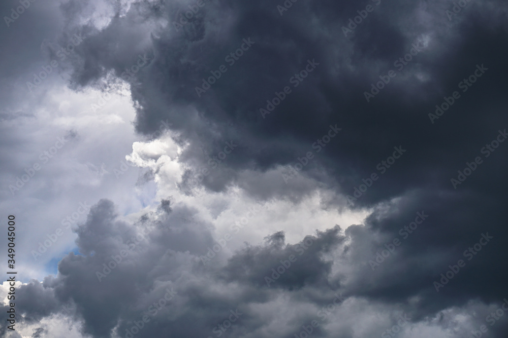 Wall mural terrible thunderclouds from the side of a plane. gloomy epic clouds. background image in a dark gray