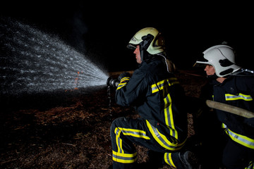 Fire brigade in action at night time