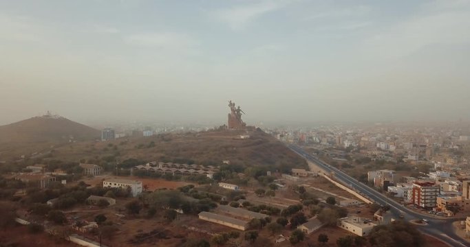 a huge monument on Africa's independence mountain with a view of the city photographed from the throne