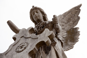 Sculpture of an angel caring for a grave in the Recoleta cemetery in Buenos Aires